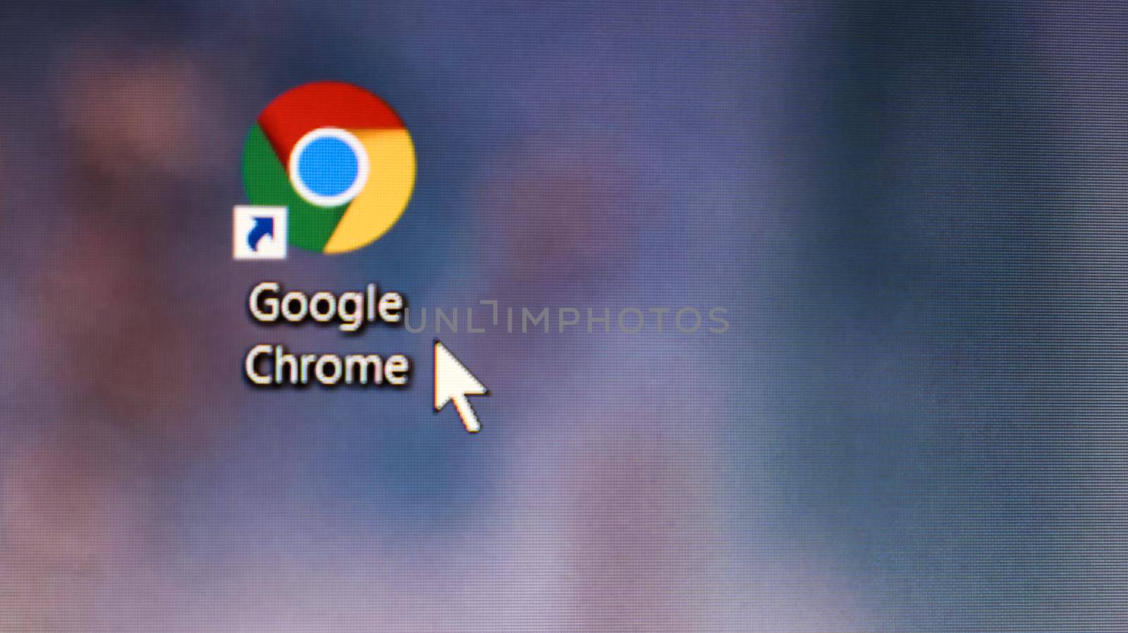 Ukraine, Kiev - April 23, 2020. Close-up of the icon of the Google Chrome browser application on the desktop of a computer screen. The mouse cursor is over the shortcut to the Internet browser
