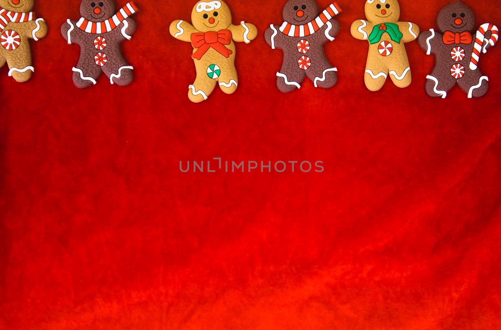 Christmas food. Gingerbread man cookies in Christmas setting. Xmas red background top view retro modern design by Annebel146