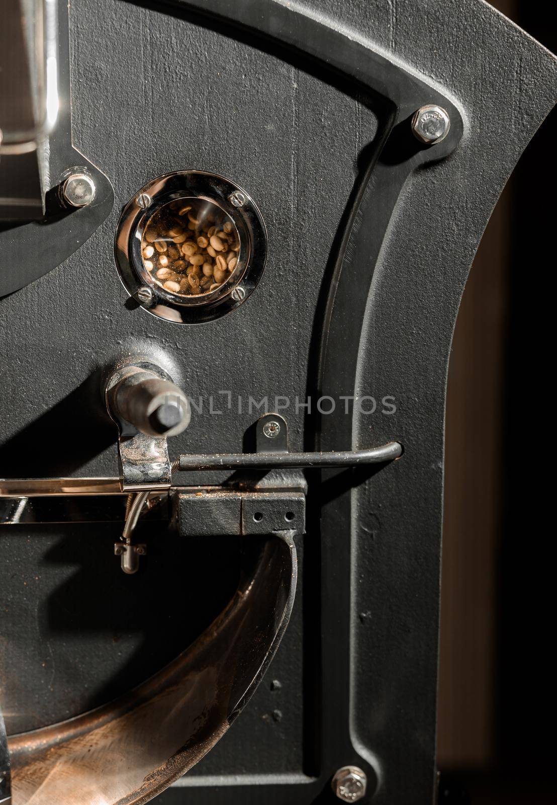 Coffee processing. Roastery, roasting machine and fresh beans by Yaroslav_astakhov