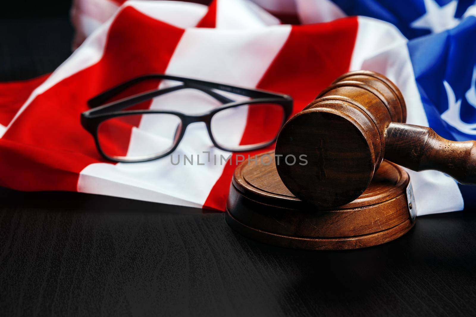 Gavel on wooden table with USA flag. High quality photo