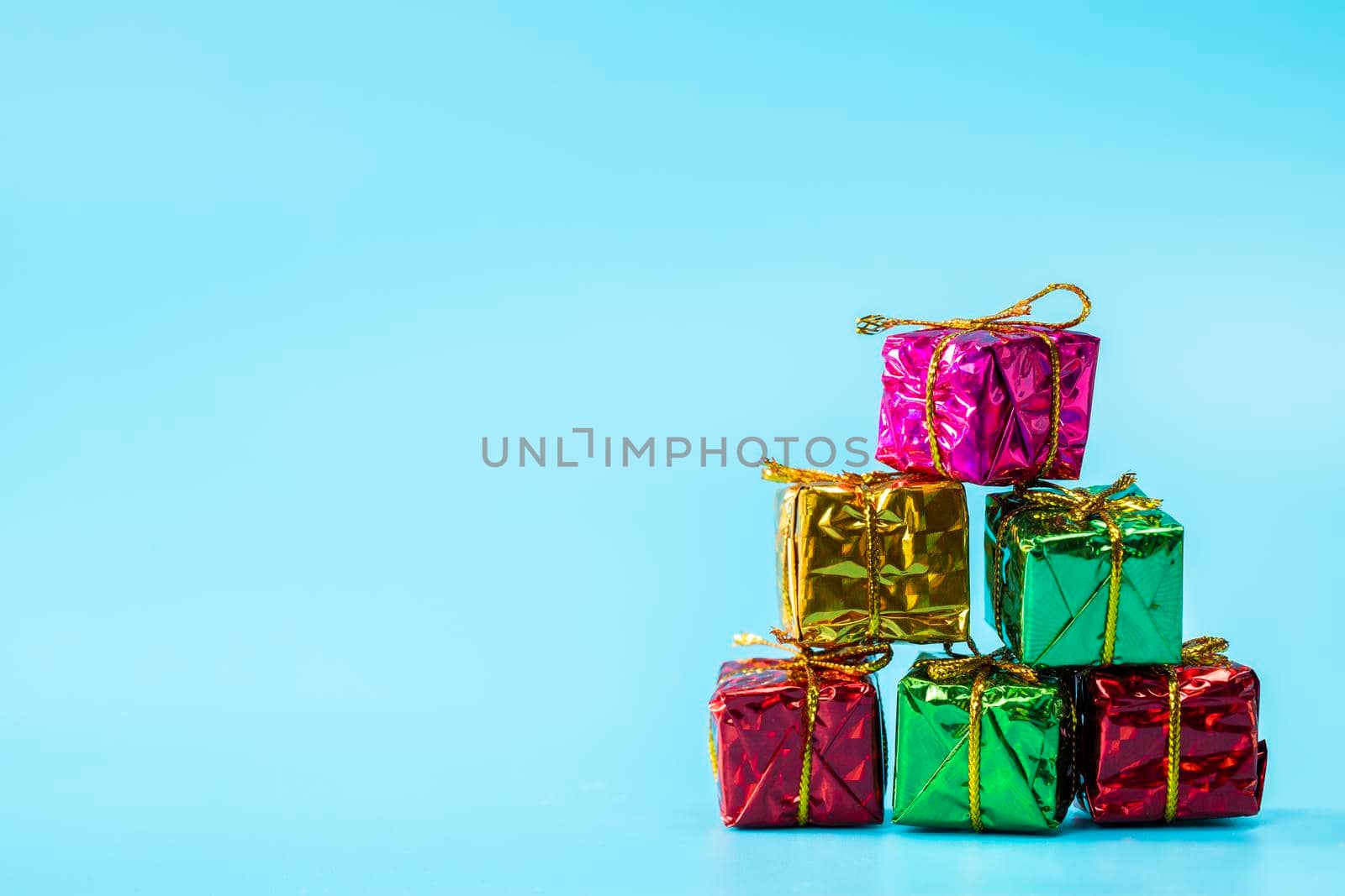 Christmas gift boxes on stylish blue background with copy space, retro modern design, Holiday,presents concept space for text