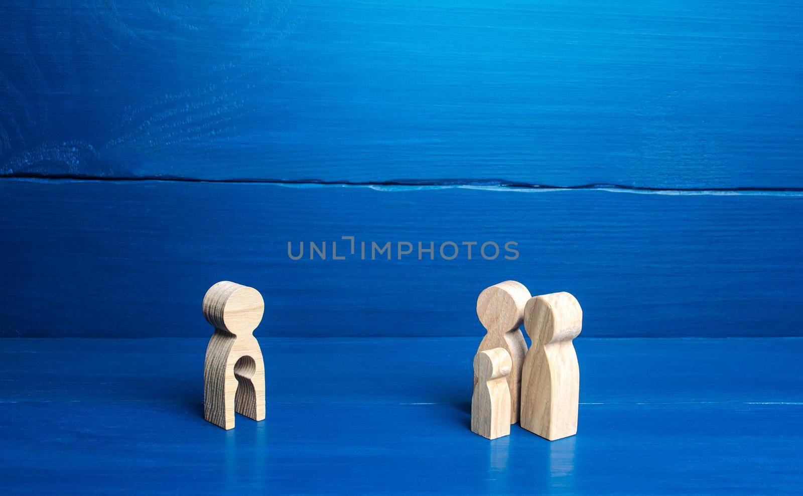 figurine with a void shape of a child and family of parents with a child. Surrogacy concept. Artificial insemination, bearing of children for childless families. Inability to have kids, infertility. by iLixe48