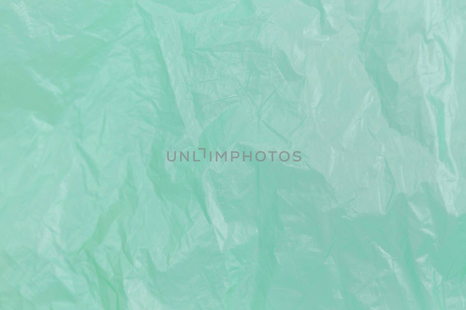 Closeup green Plastic Bag Texture, macro, background with copy space for text by lunarts