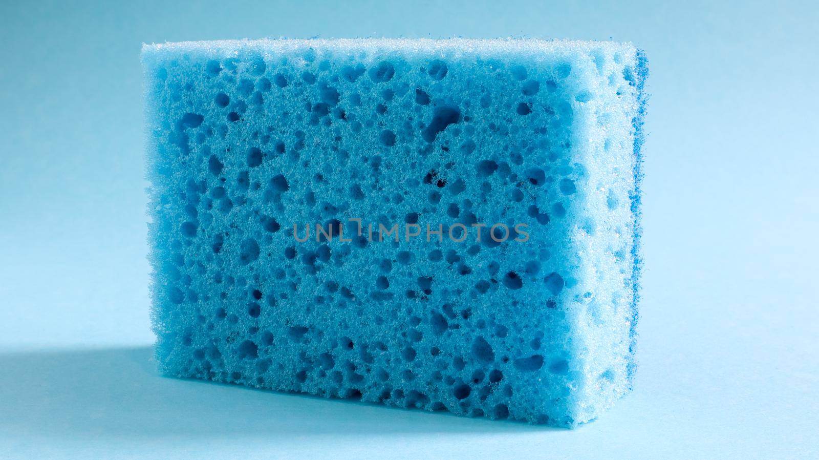 One blue sponge used to wash and erase dirt used by housewives in everyday life. They are made of porous material such as foam. Detergent retention, which allows you to spend it economically.