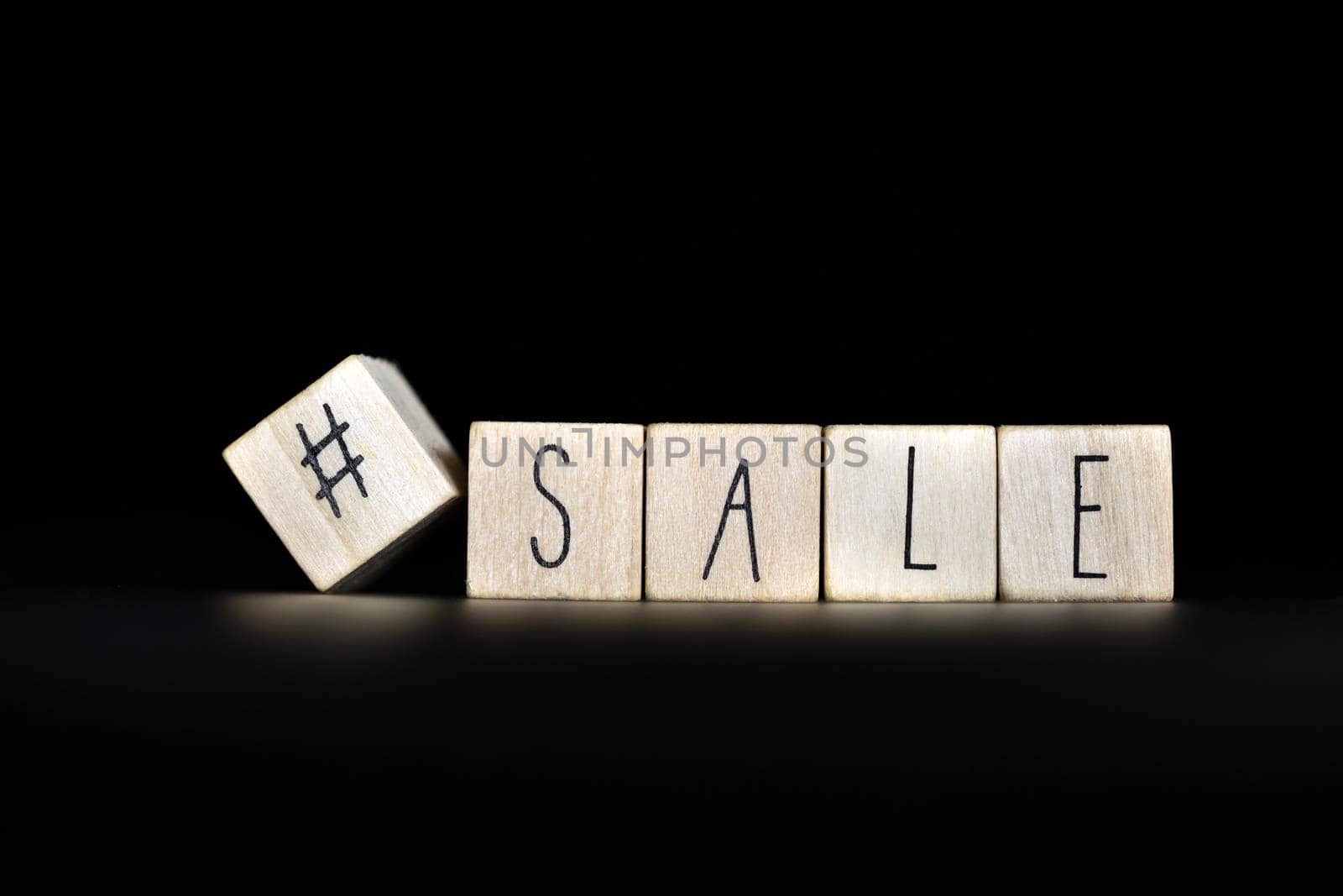 Hashtag and sale written on a black background with space for text. Concept of selling products online store, social media on Black by Annebel146
