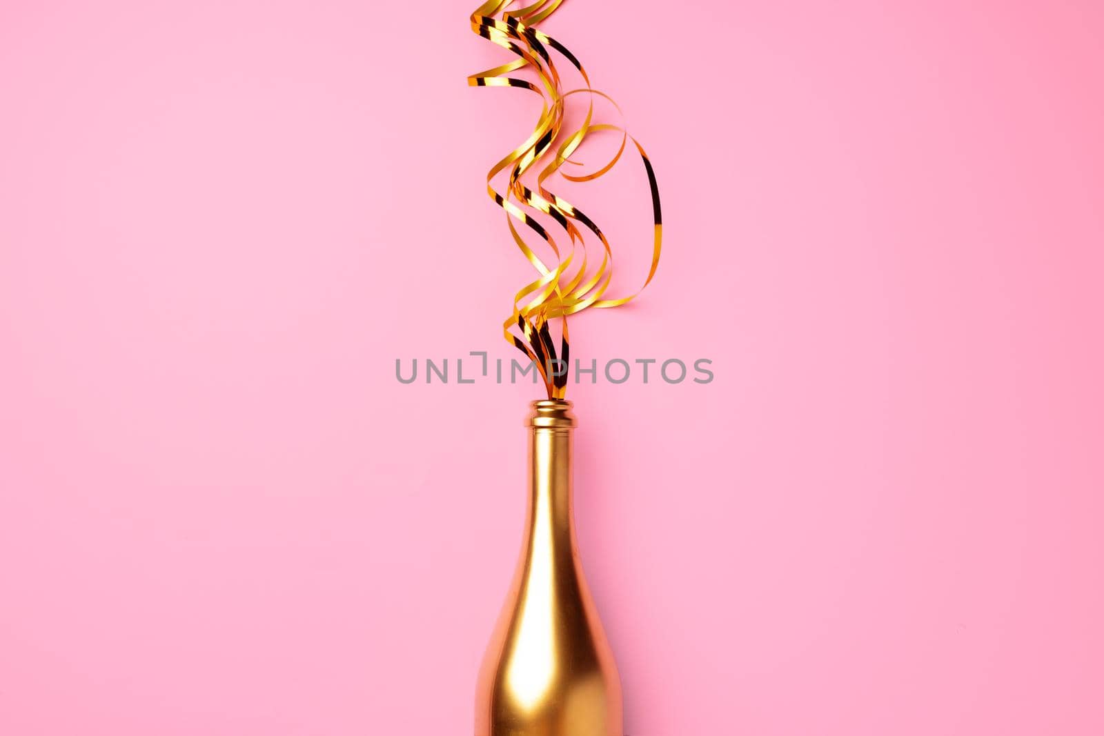 Champagne bottle with streamers flat lay top view, Christmas background