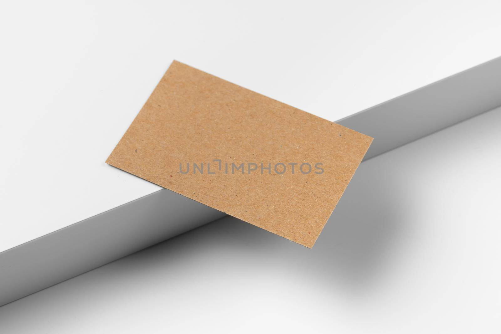 Empty craft business cards on white background. Close up.