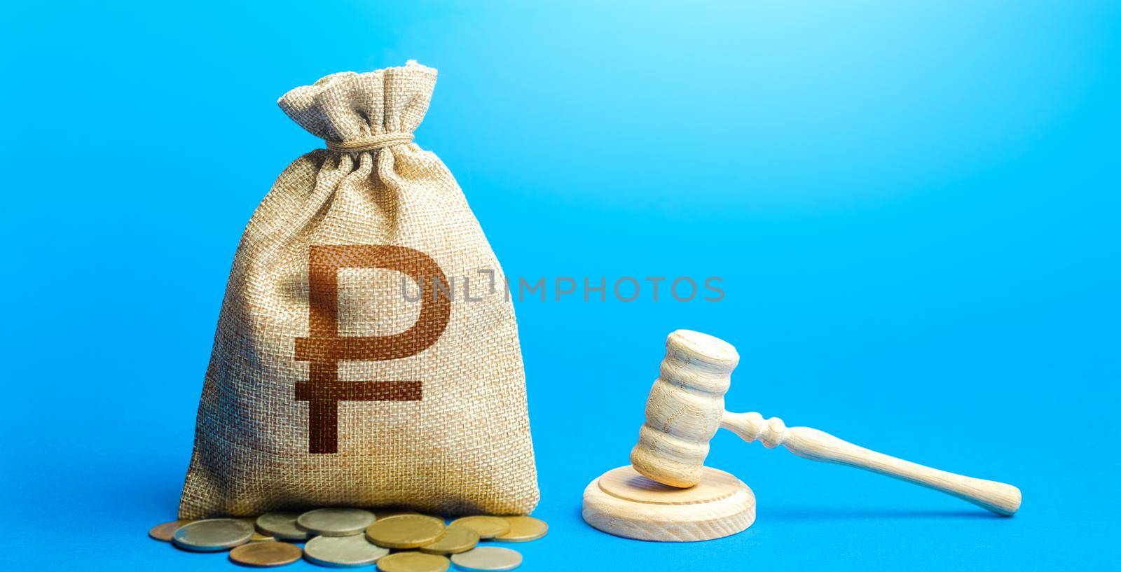 Russian ruble money bag and judge's gavel. Justice. Lawyer services. Awarding moral financial compensation. Protection rights. Litigation, dispute resolution, conflict of interest settlement.
