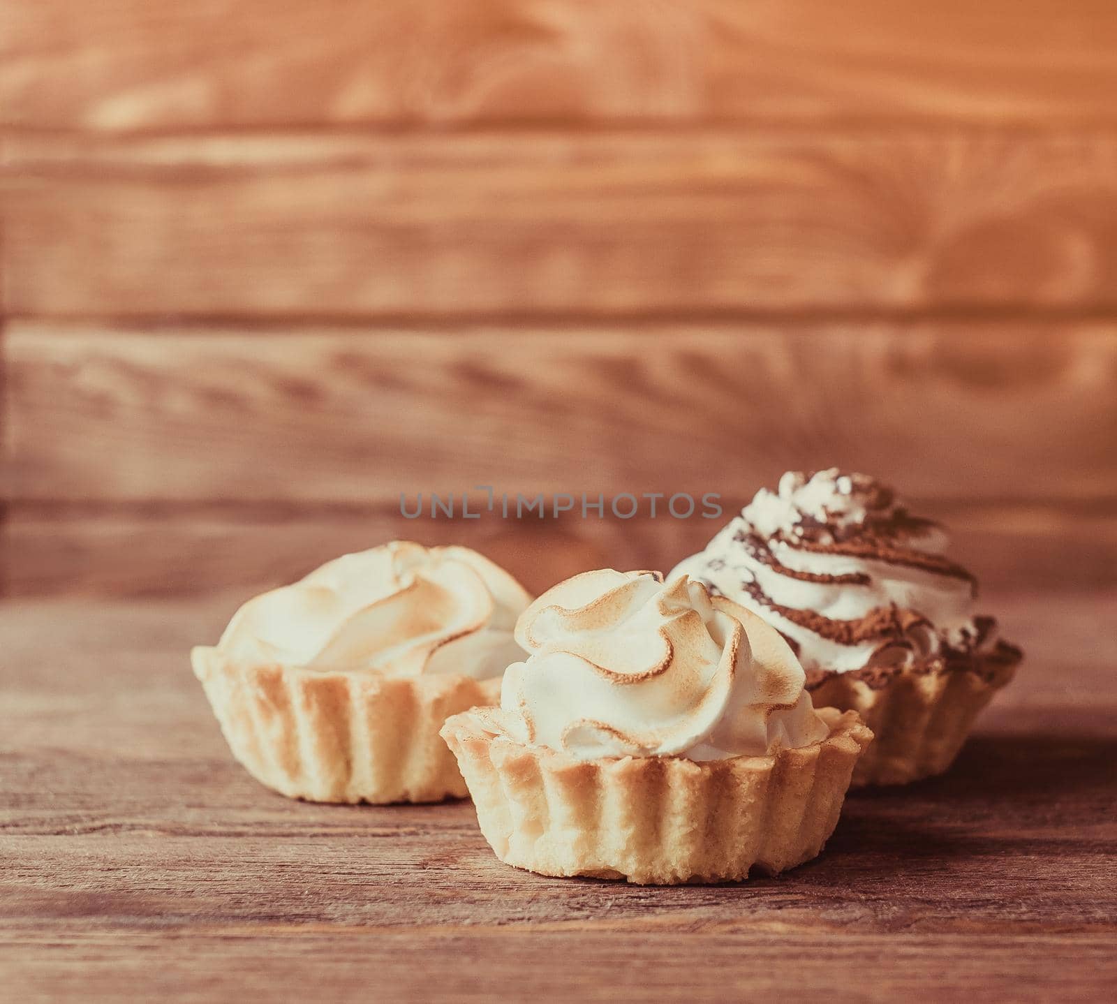 Three holiday cupcakes with cream. by alexAleksei