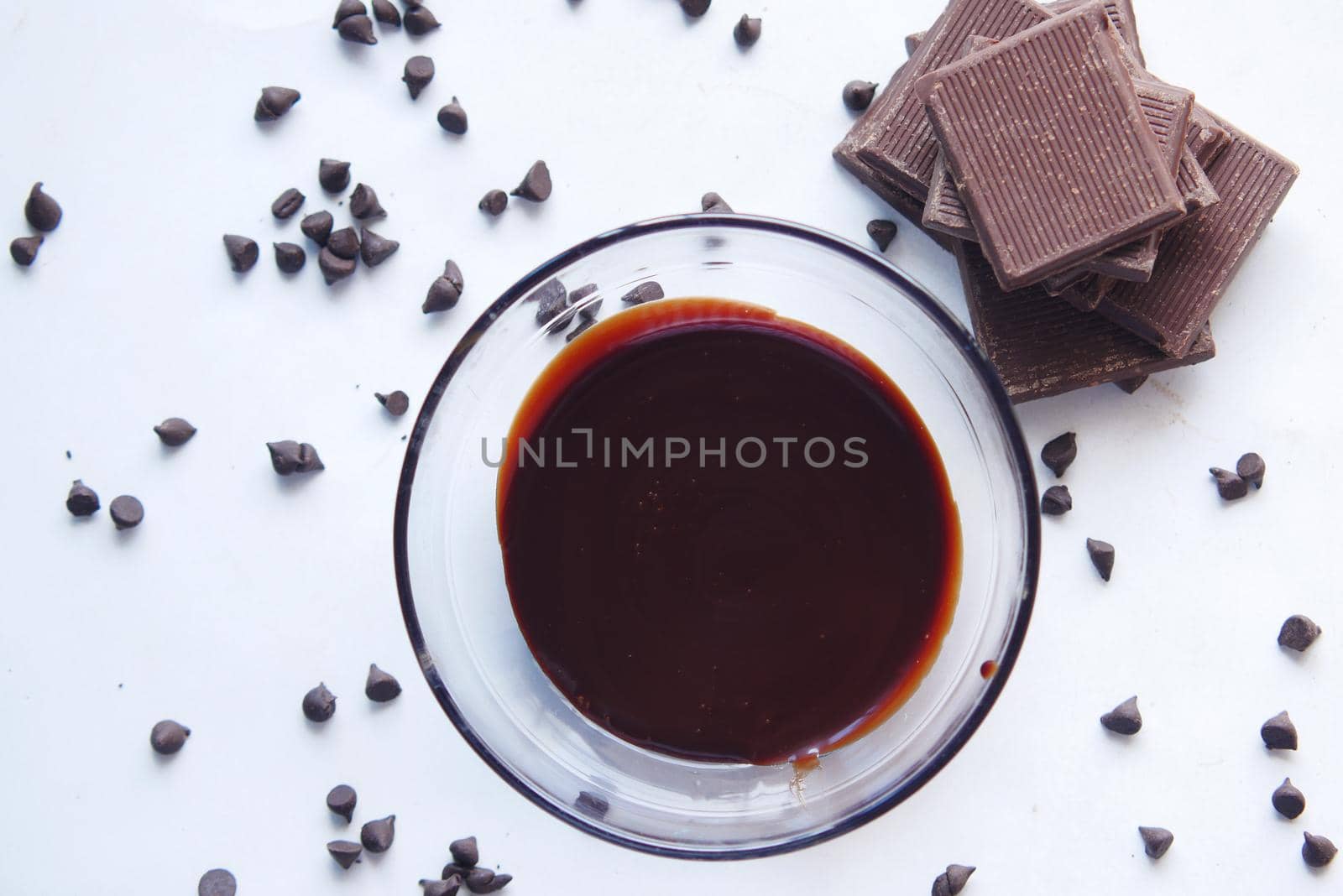 dark chocolate cream in a bowl on white .