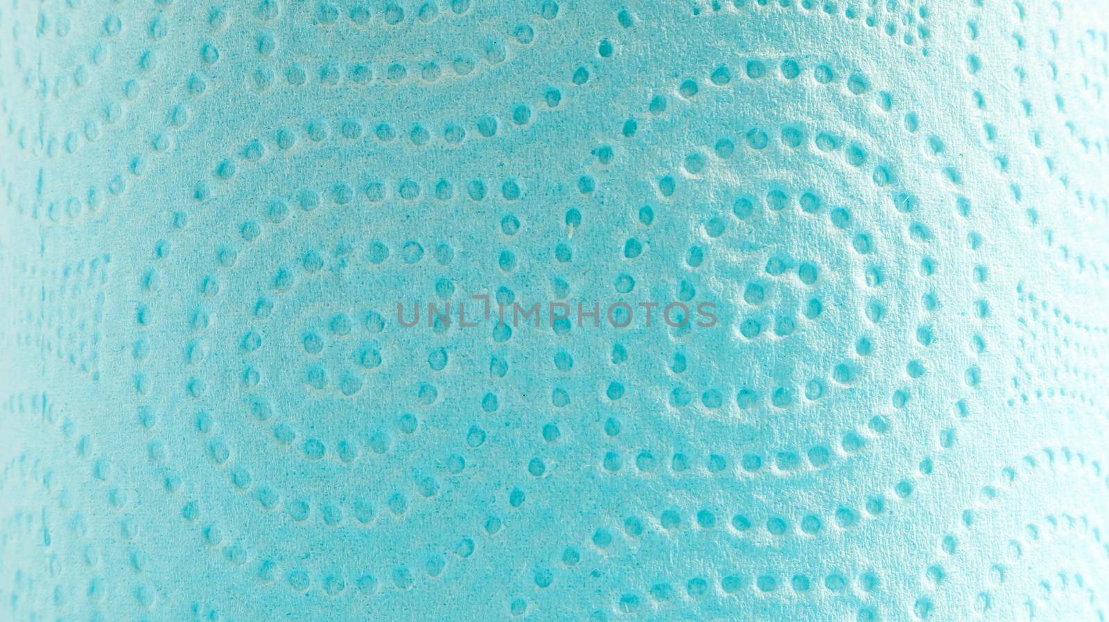 Blue roll of modern toilet paper on a blue background. A paper product on a cardboard sleeve, used for sanitary purposes from cellulose with cutouts for easy tearing. Embossed drawing.