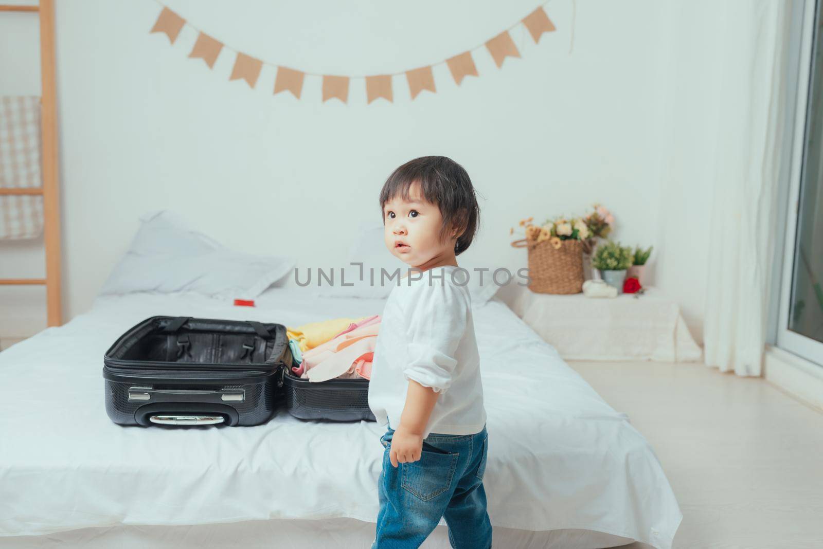 Cute girl standing front suitcase, prepare or ready to travel concept