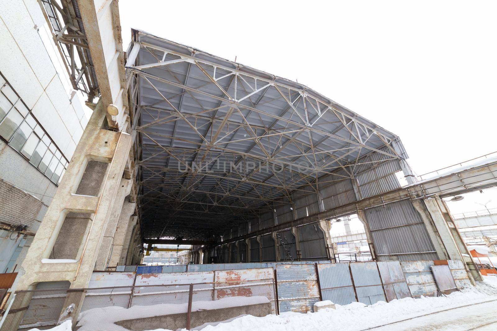 Industrial concept. An industrial empty construction. View from the outside. Mid shot