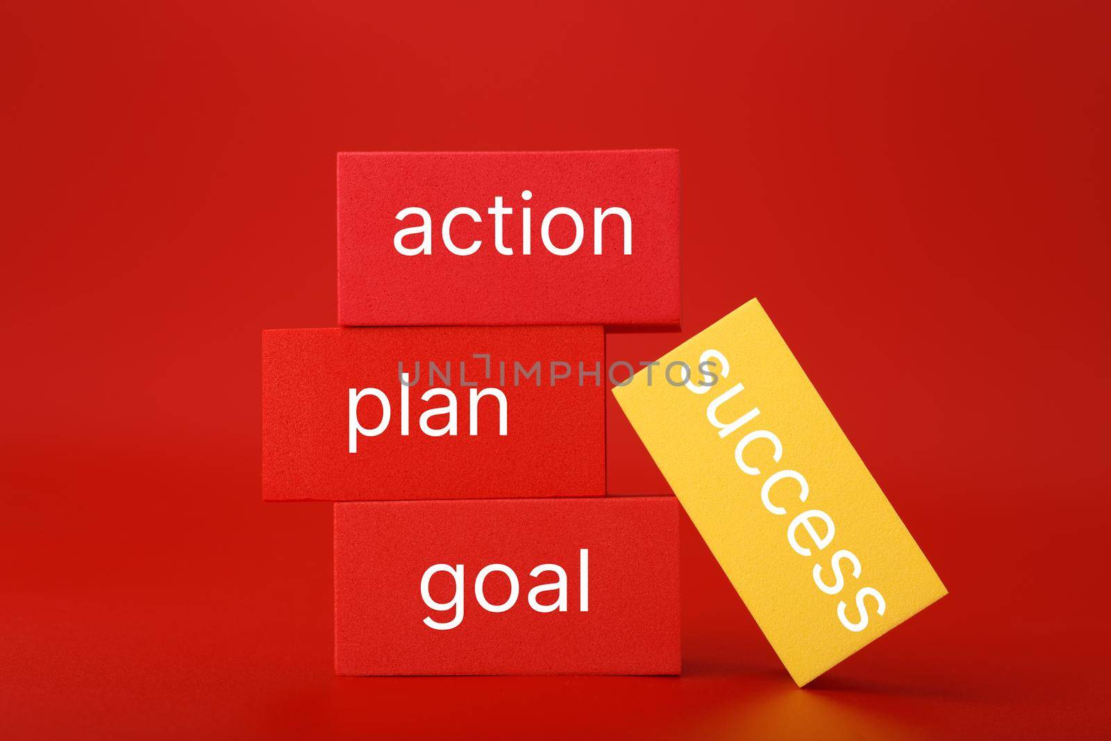 Success formula or strategy concept in red colors. Goal, plan, action written on red and yellow rectangles against red background by Senorina_Irina
