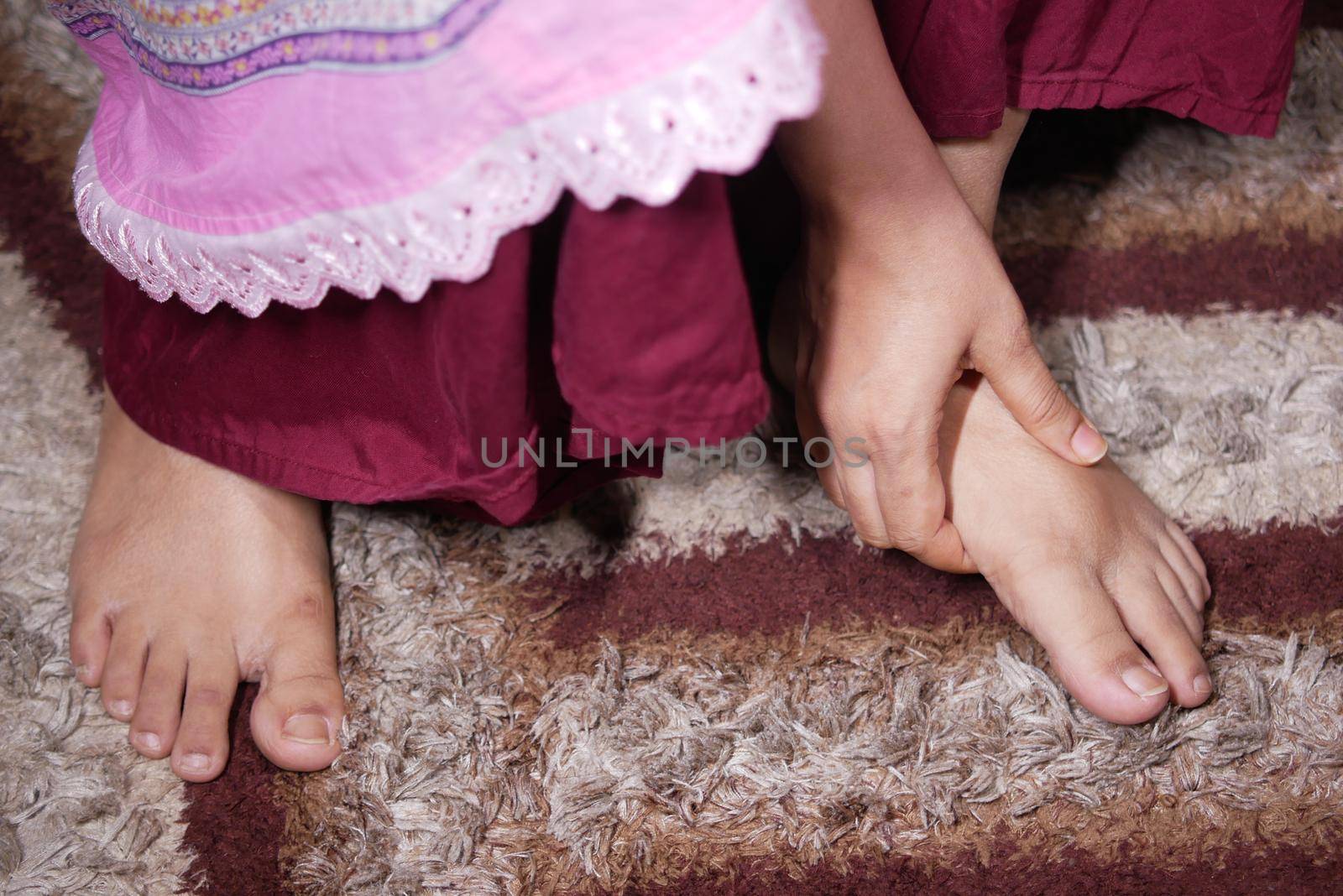 Close up on women feet and hand massage on injury spot