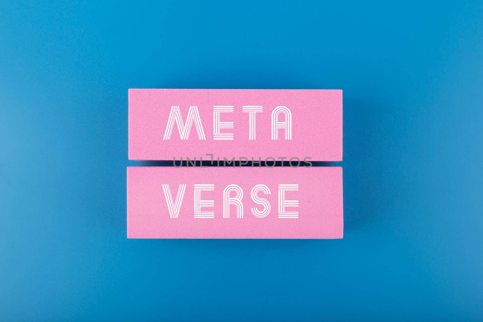 Metaverse modern minimal concept in blue colors. Written metaverse single word on two pink rectangles against dark blue background. Future computer technologies.