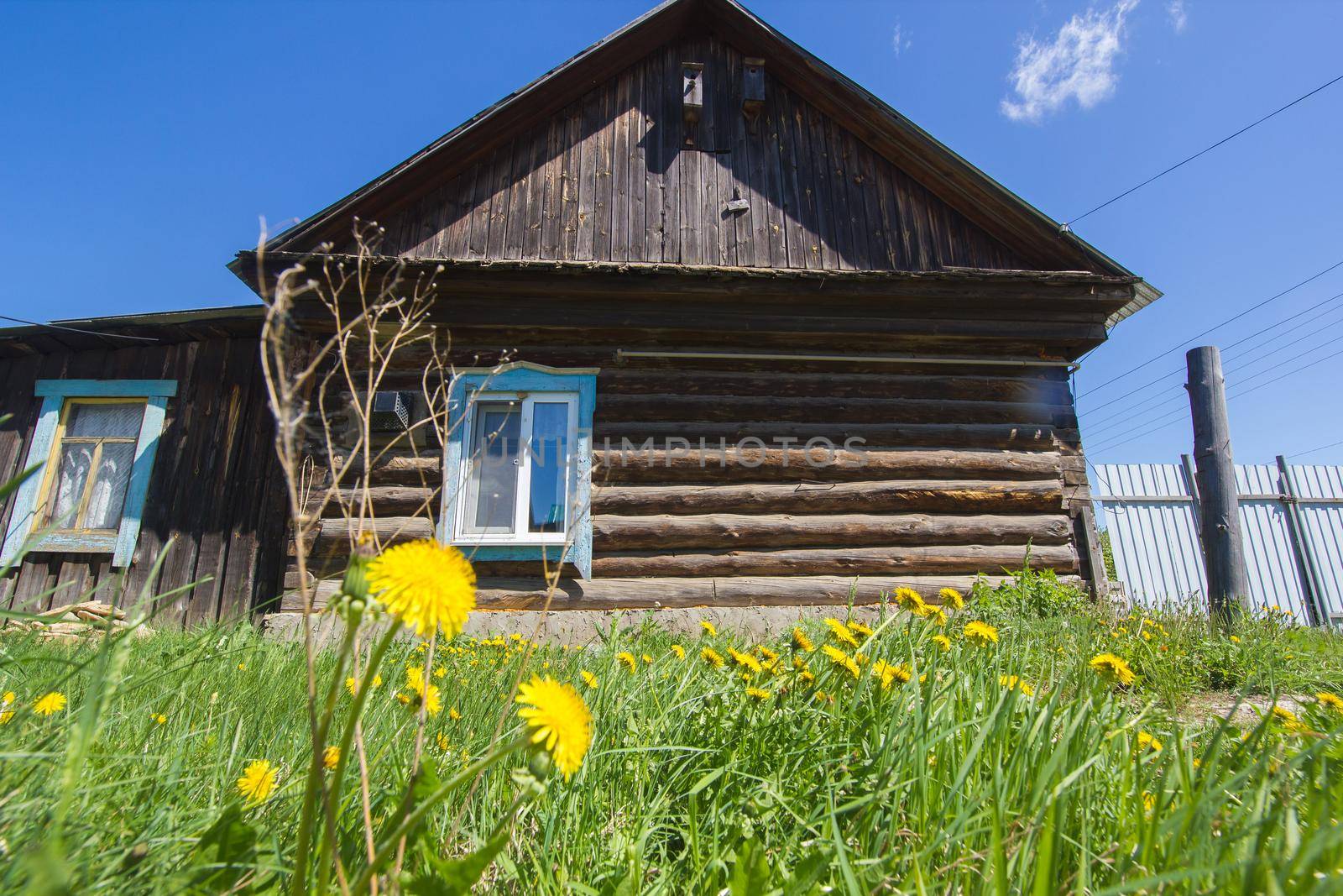 Small wooden house at countryside in old Russian village, horizontal