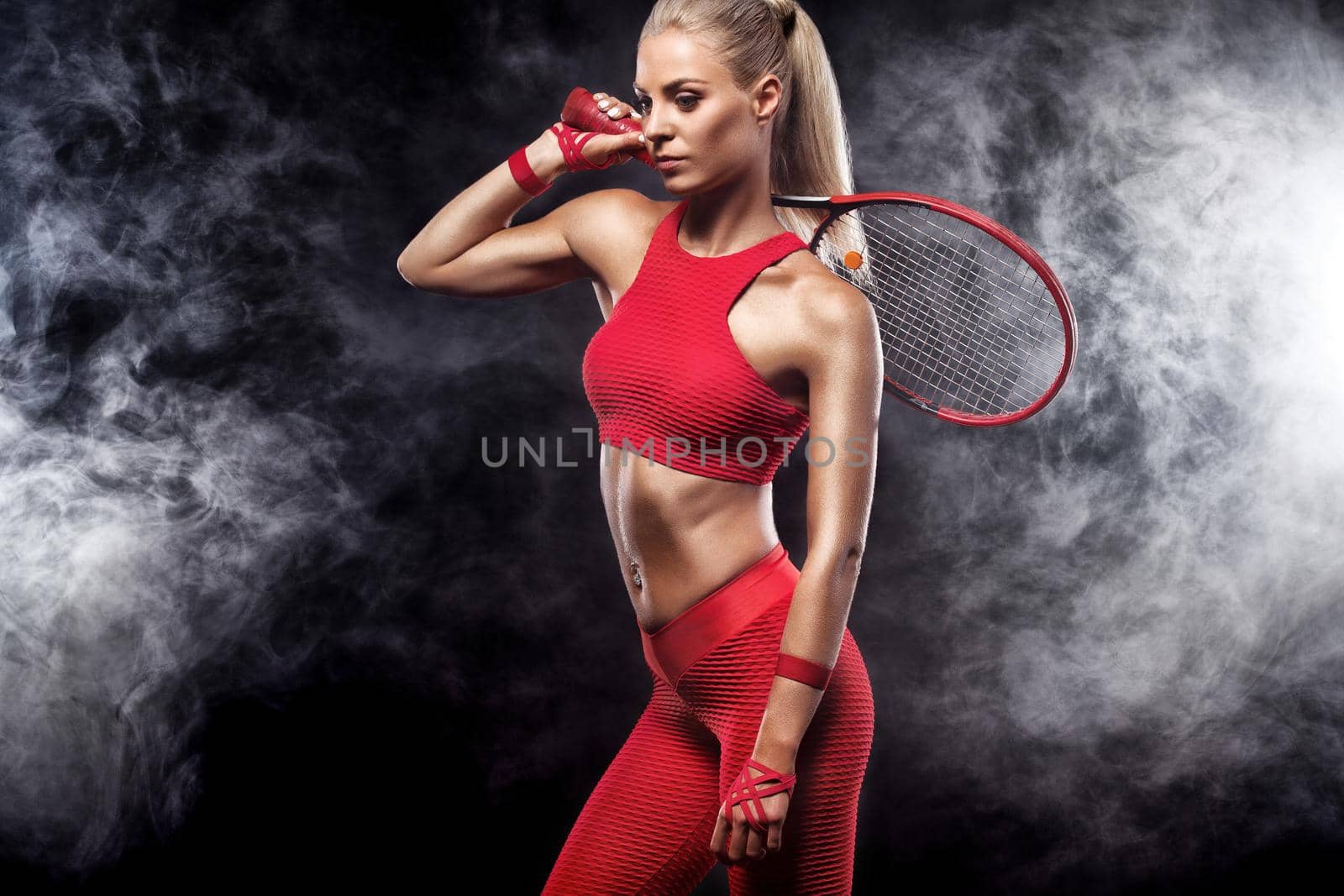 Beautiful blonde sport woman tennis player with racket in red costume by MikeOrlov