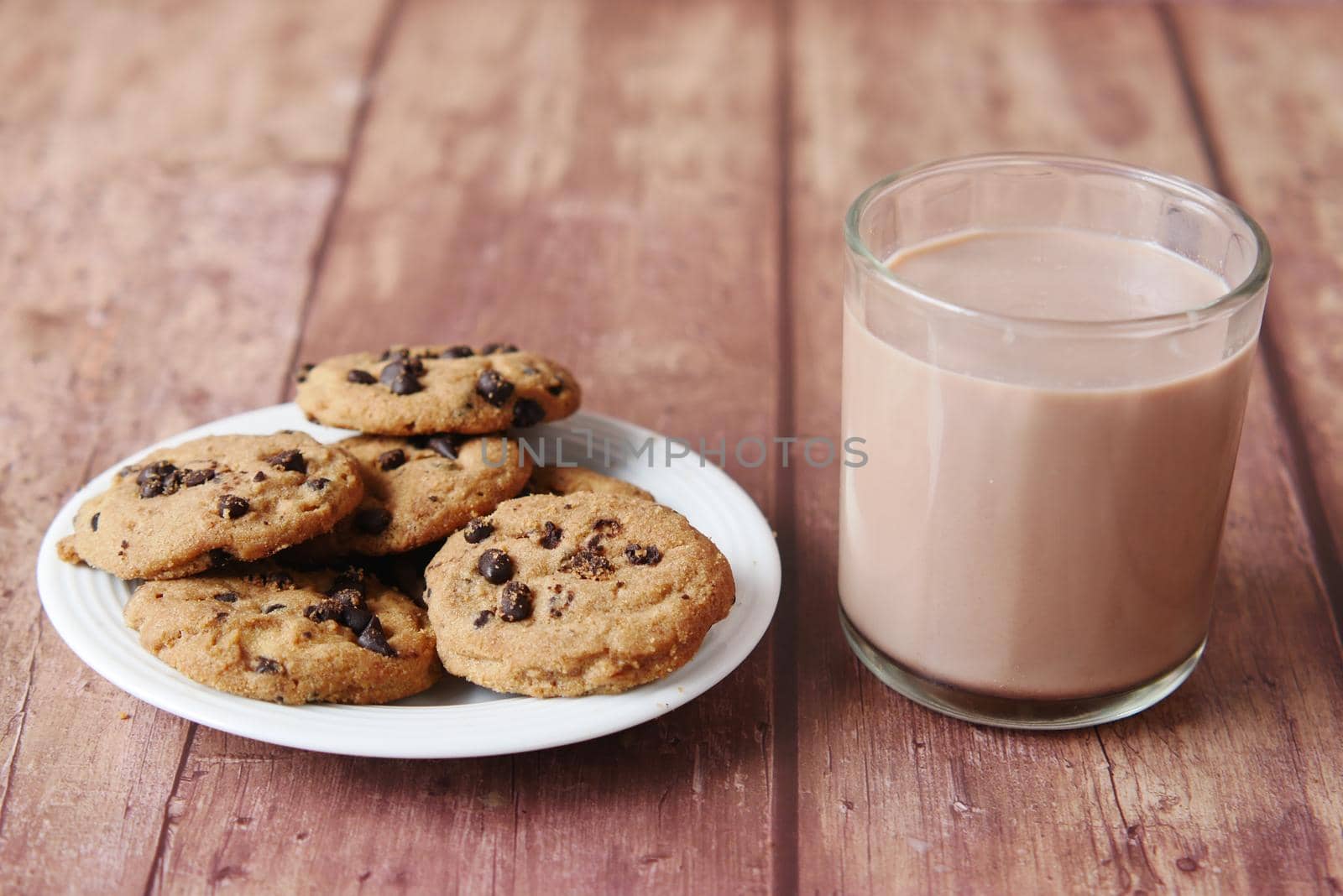 chocolate cooking and a glass of chocolate milkshake on table ,