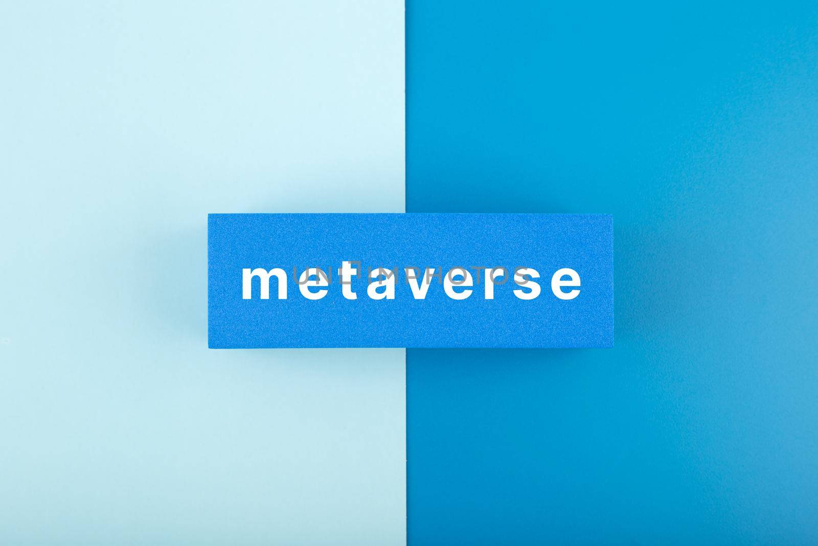 Metaverse modern minimal concept in blue colors. Written metaverse single word on blue rectangle against blue background. Future technologies.
