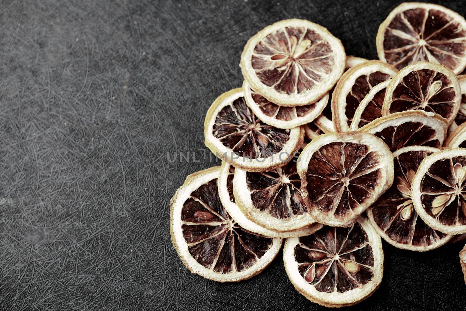 close up of dry lemon on a black background , top view