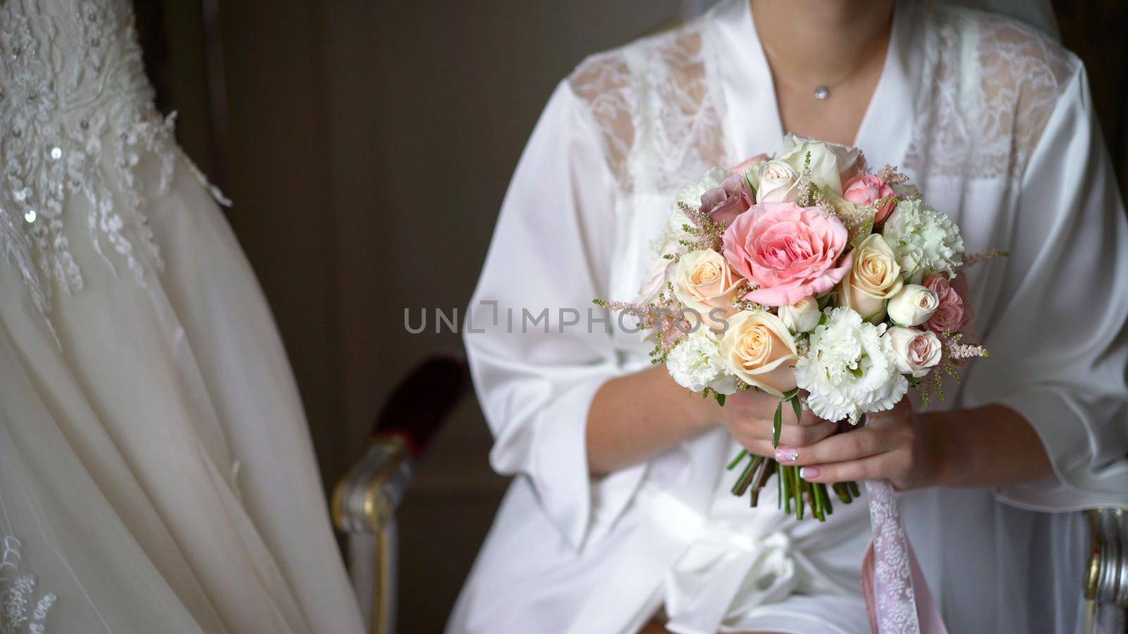 Bride holding bridal bouquet. Bride with bouquet, closeup