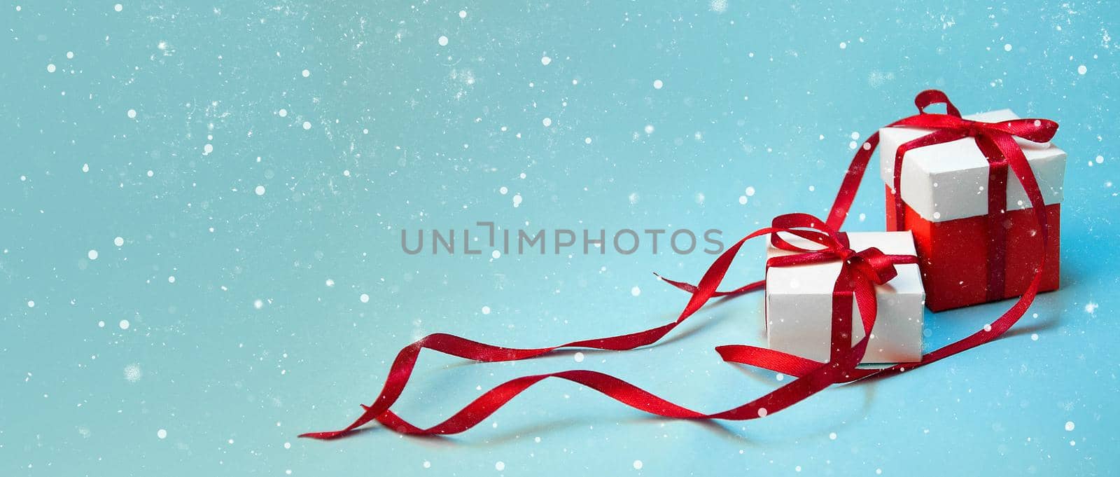 Christmas Gift's in White Box with Red Ribbon on Light Blue Background. New Year Holiday Composition Banner. Copy Space For Your Text by Svetlana_Belozerova