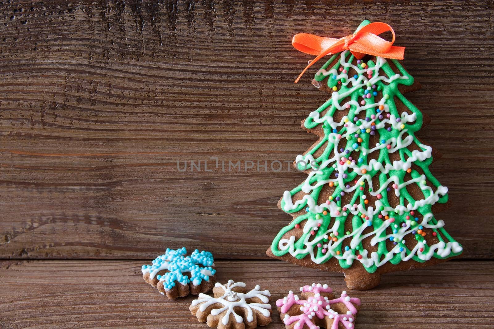 Christmas gingerbread on a brown wooden background
