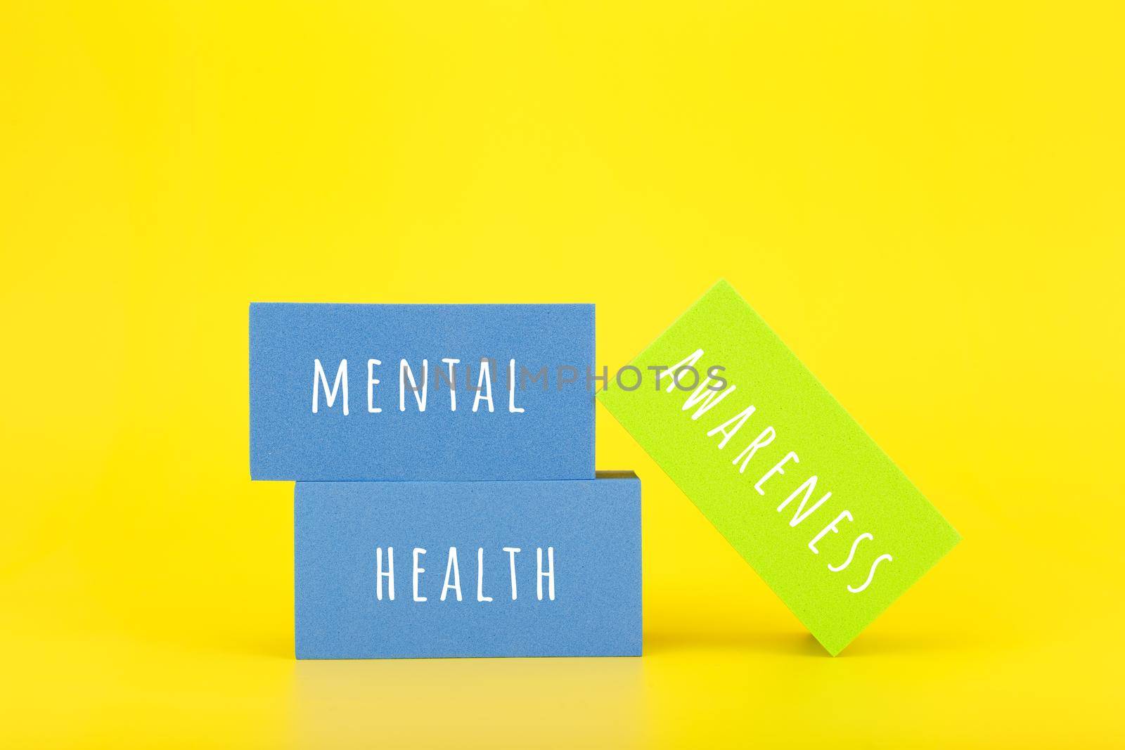 Mental health awareness minimal colorful concept on yellow background. Stack of rectangles with text by Senorina_Irina