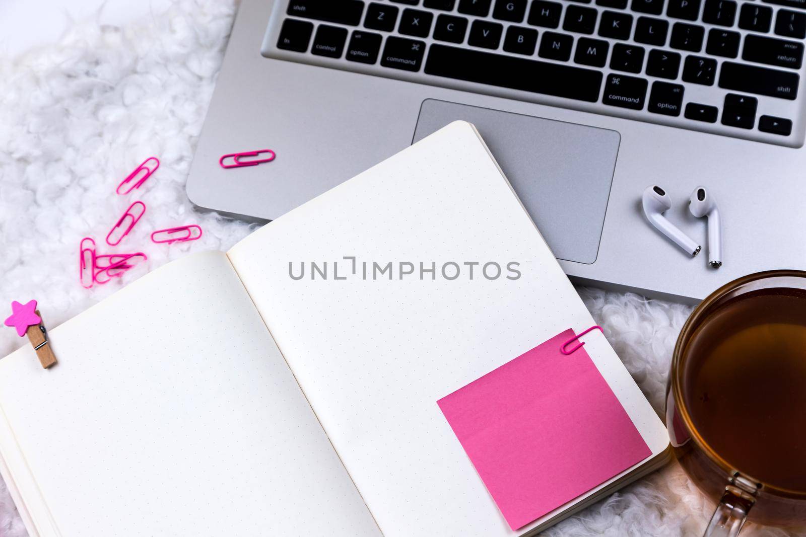 Home office desk workspace with laptop and tea cup on white background. Flat lay, top view girl boss work business concept. Work at home concept on coronavirus quarantine