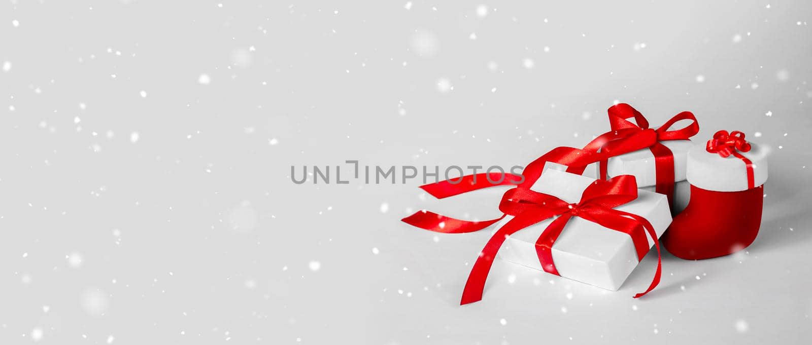 Christmas Gift's in White Box with Red Ribbon on Light Background by Svetlana_Belozerova