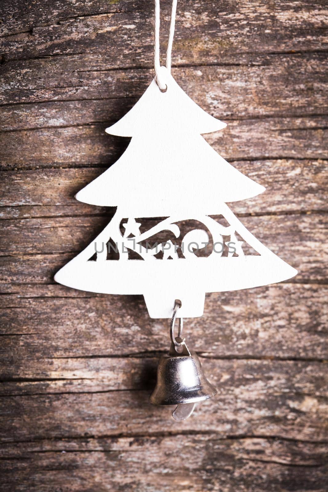 Christmas decorations - white wooden fir tree over shappy old background
