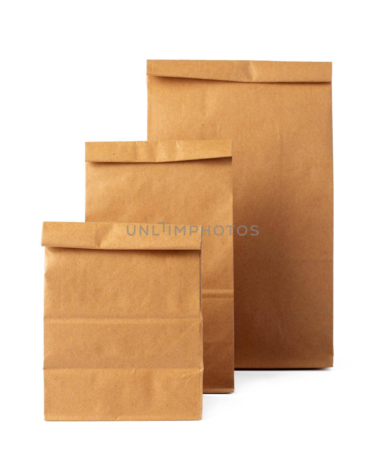 Brown craft paper bag packaging template on white background close up