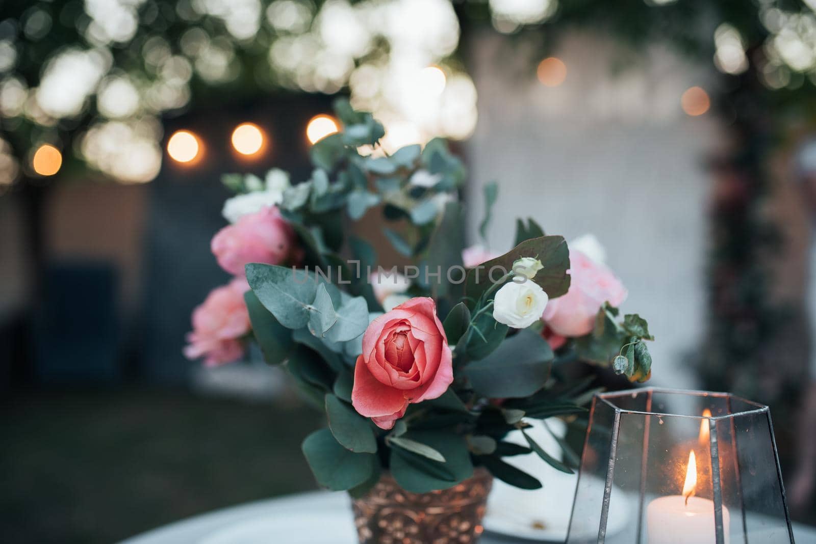 Beautiful flowers in rustic style at a wedding party.