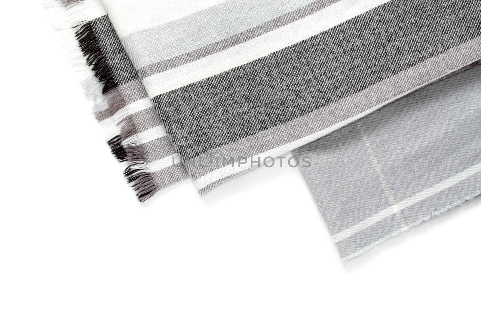 Part of a beautiful gray scarf in a cage isolated on a white background with an area for text