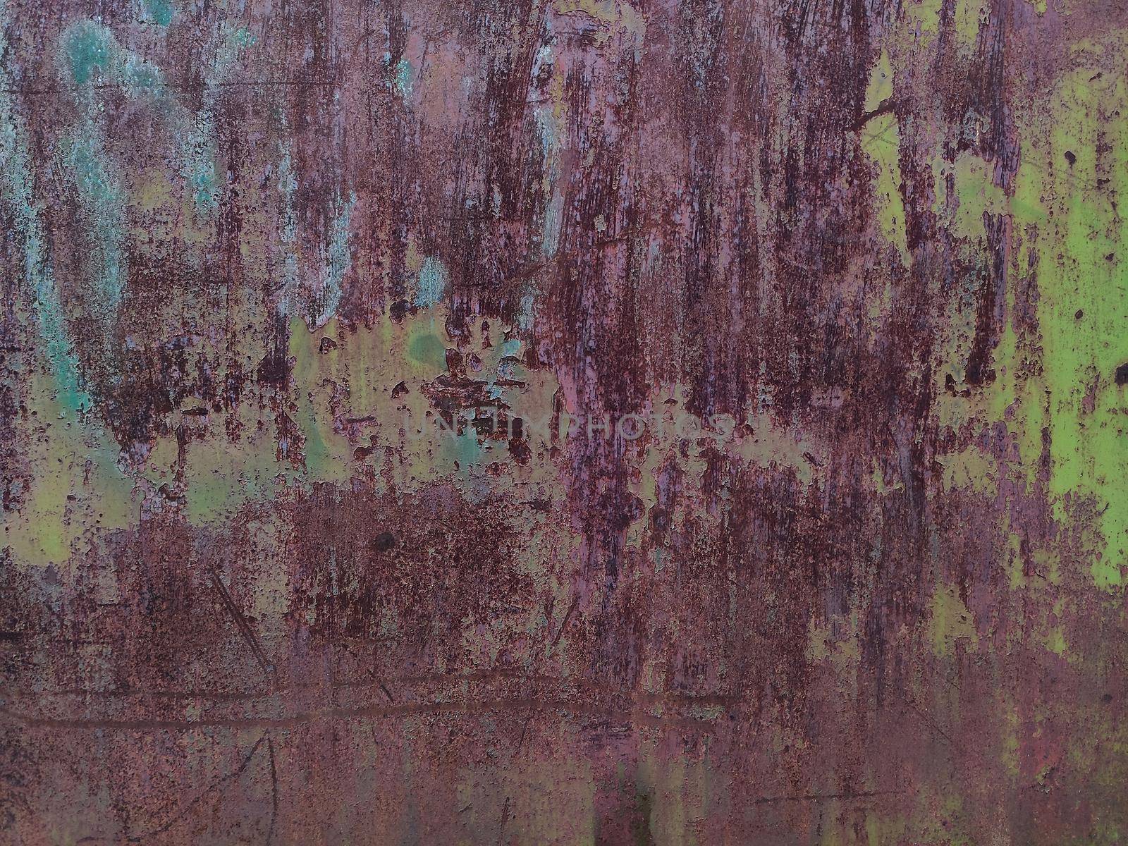 Corroded metal background. Rusted painted metal wall. Rusty metal background with streaks of rust. Rust stains. The metal surface rusted spots. Rystycorrosion.