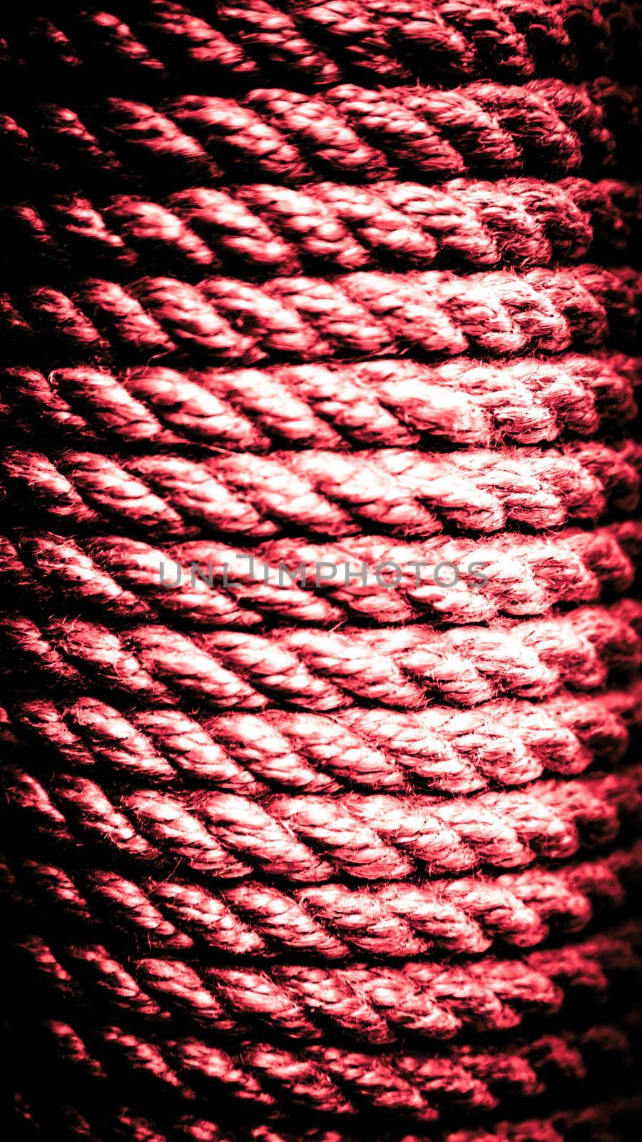 Vertical old red rope background. Rope texture. Close-up rope texture.