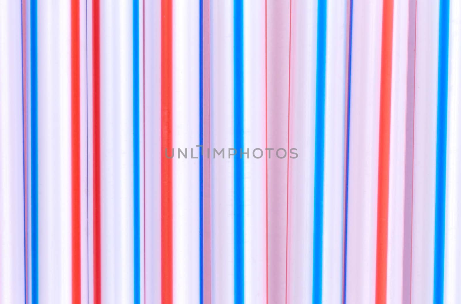 Multicolor cocktail tubes texture. On white background. Close up.