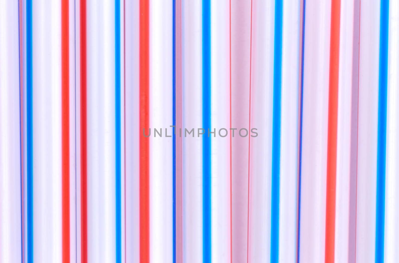 Multicolor cocktail tubes texture. On white background. Close up by lunarts