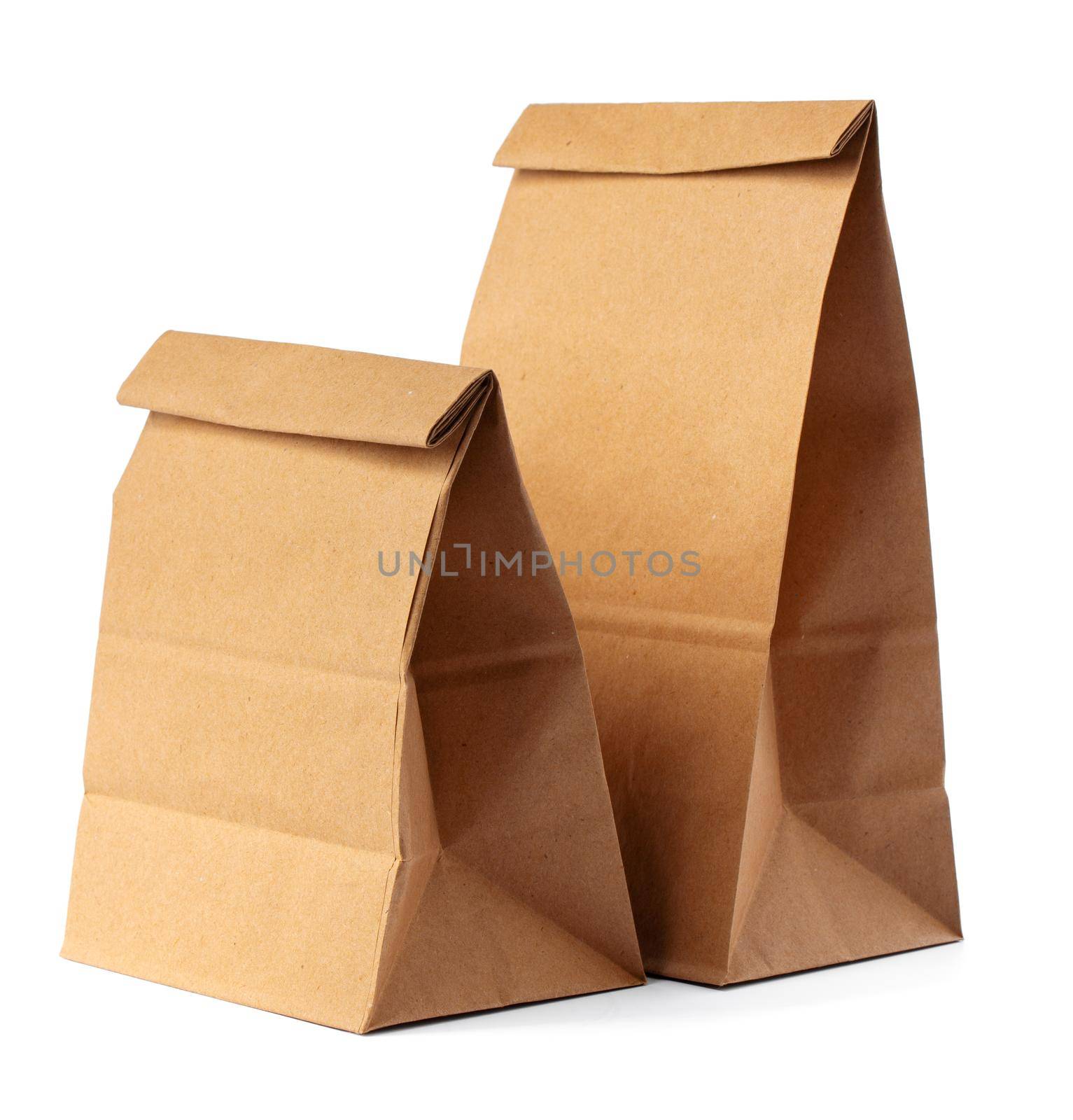 Brown craft paper bag packaging template on white background close up
