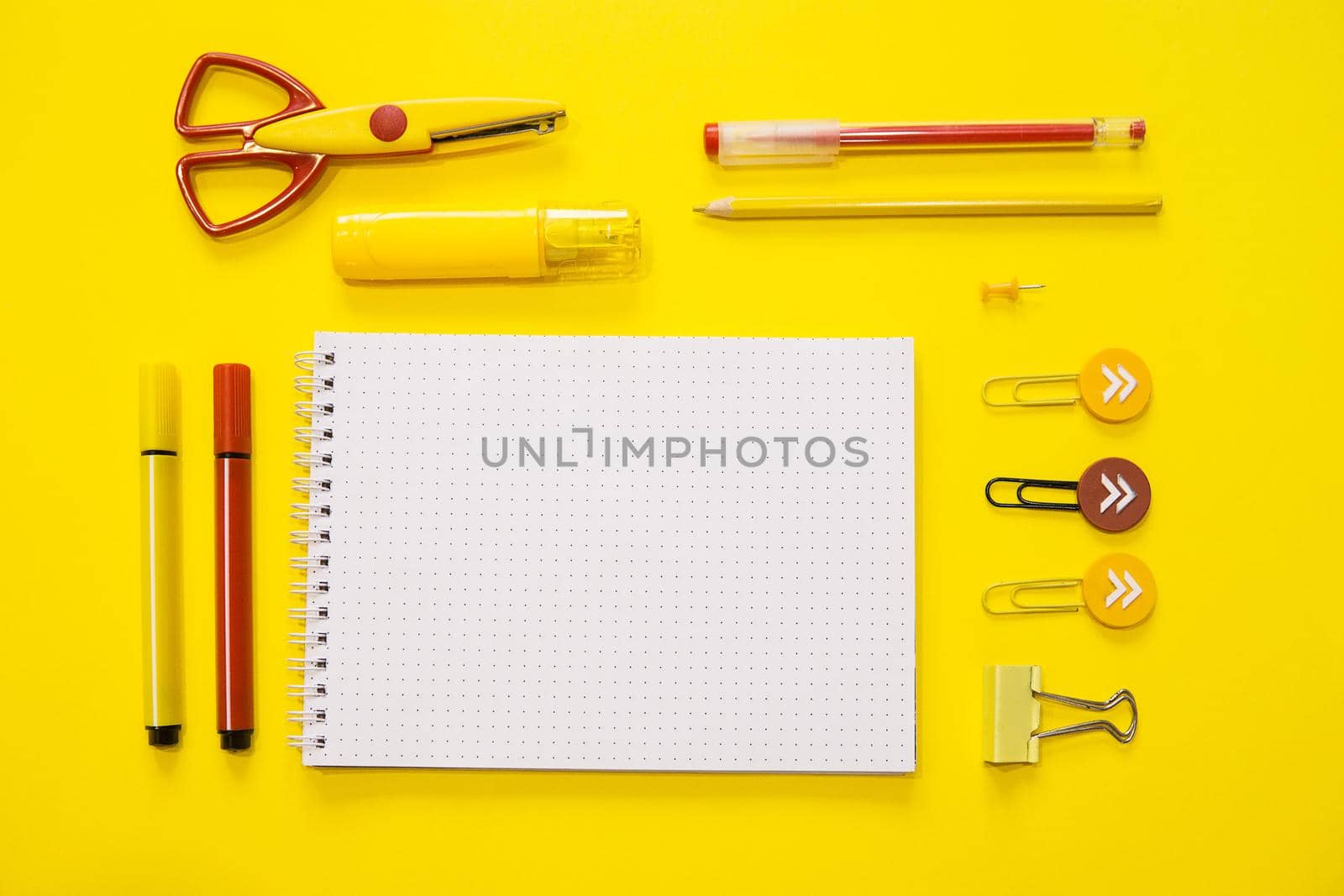 Yellow and red colors. Flat lay composition. Yellow background. Space for text. Back to school. by Annu1tochka