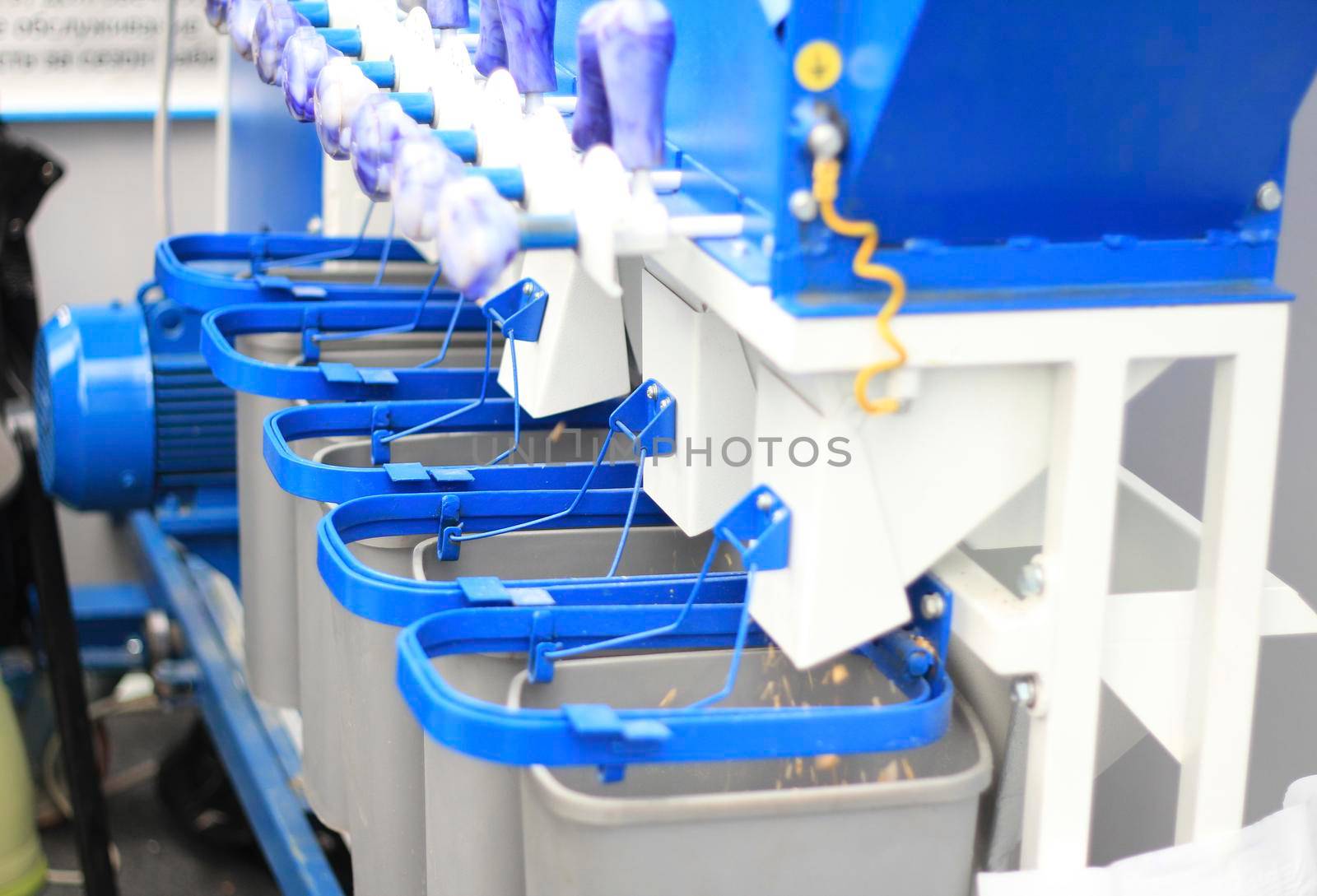 Agricultural machinery, devices for dosage at the exhibition, agribusiness concept