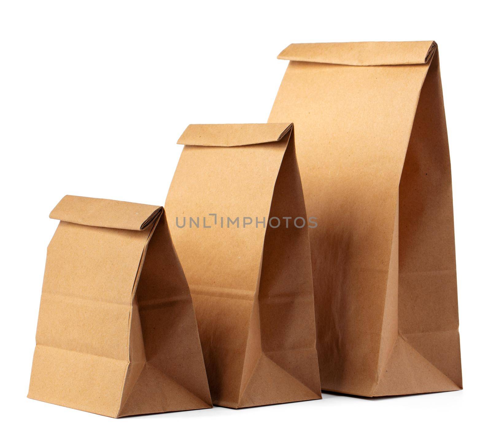 Brown craft paper bag packaging template on white background close up