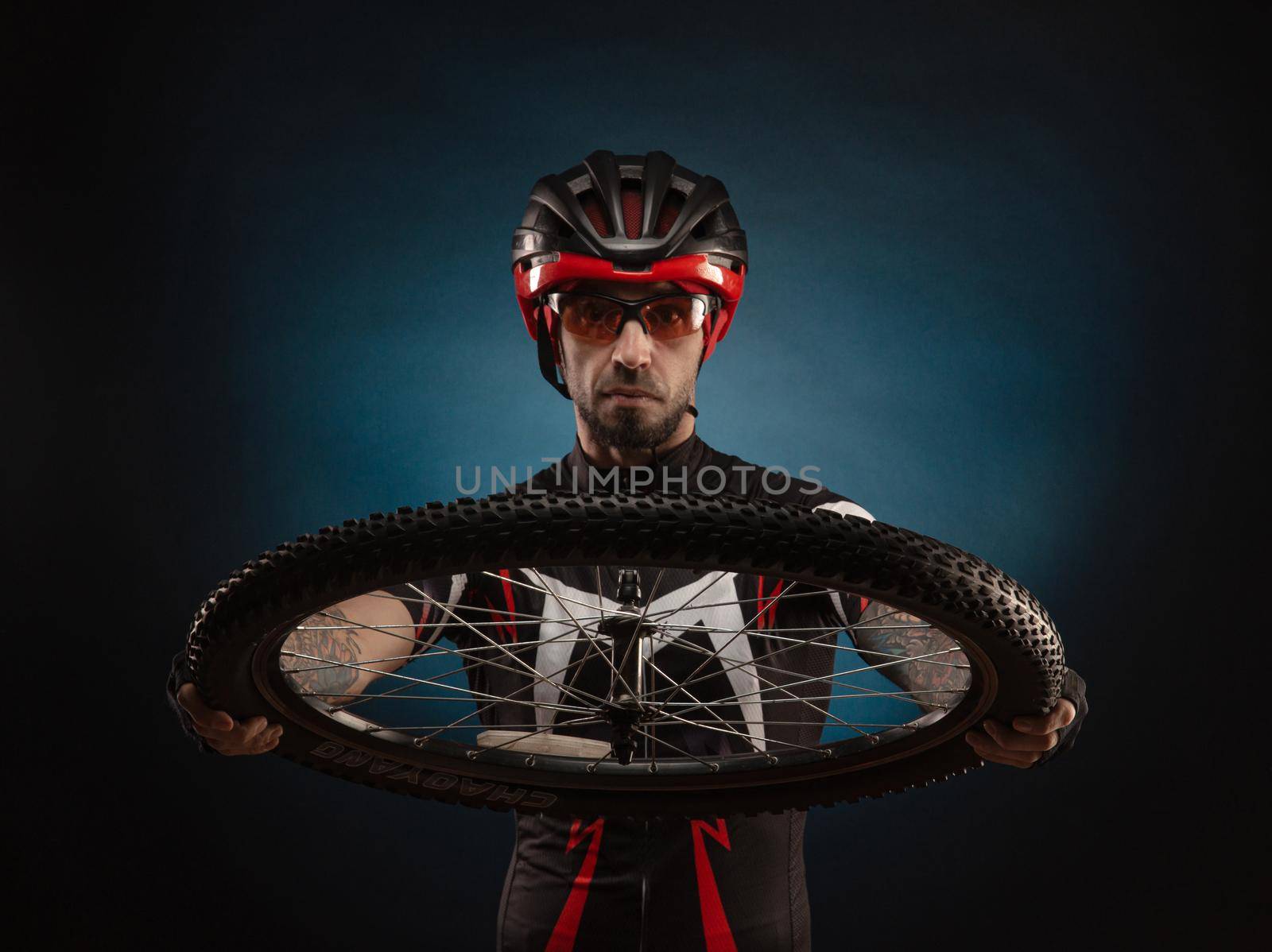 guy-cyclist in a Bicycle helmet with a Bicycle wheel by Rotozey