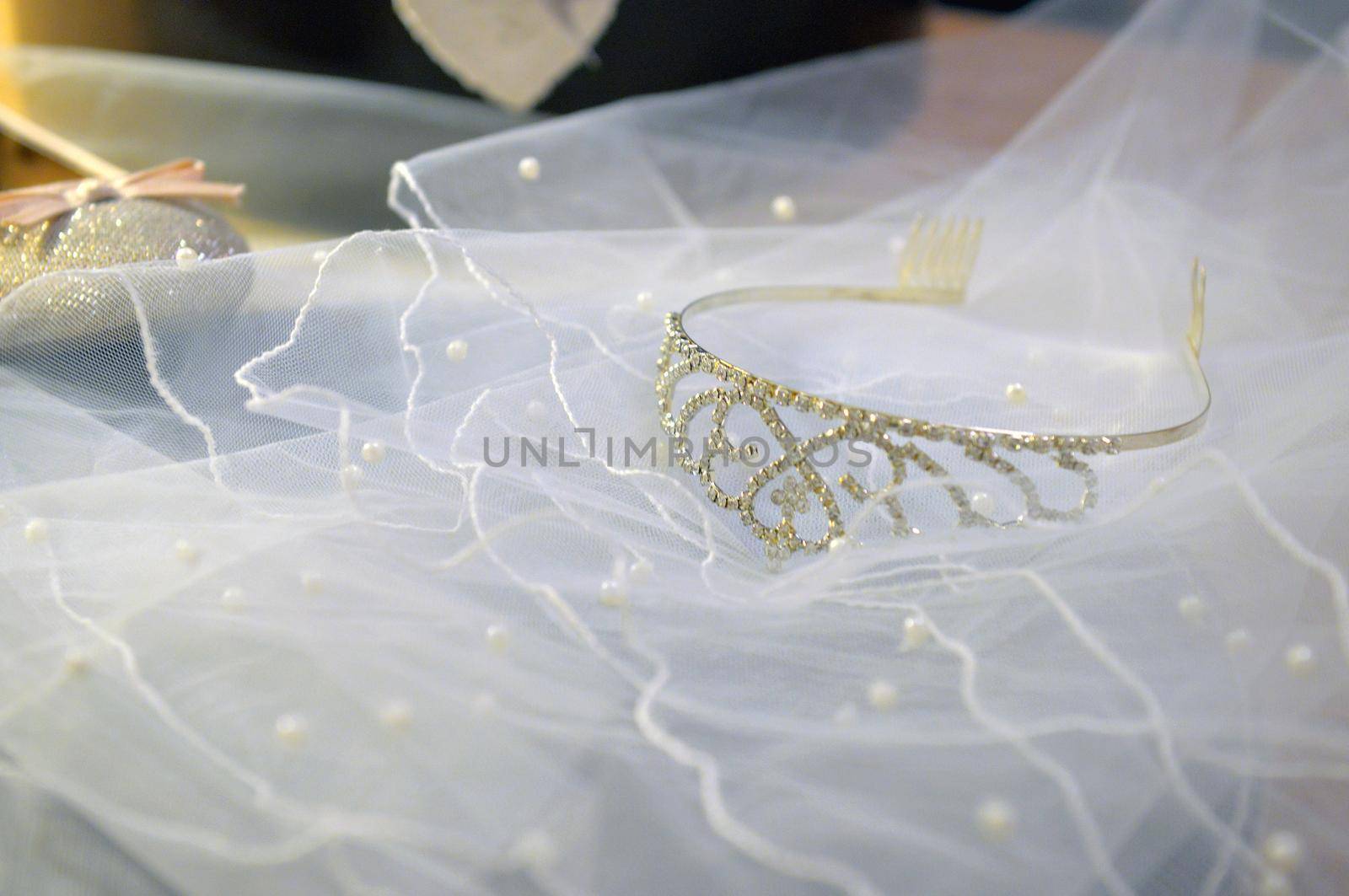 white veil lace, shining silver diadem and pink bridal shoes. bridal accessories set for happy marriage