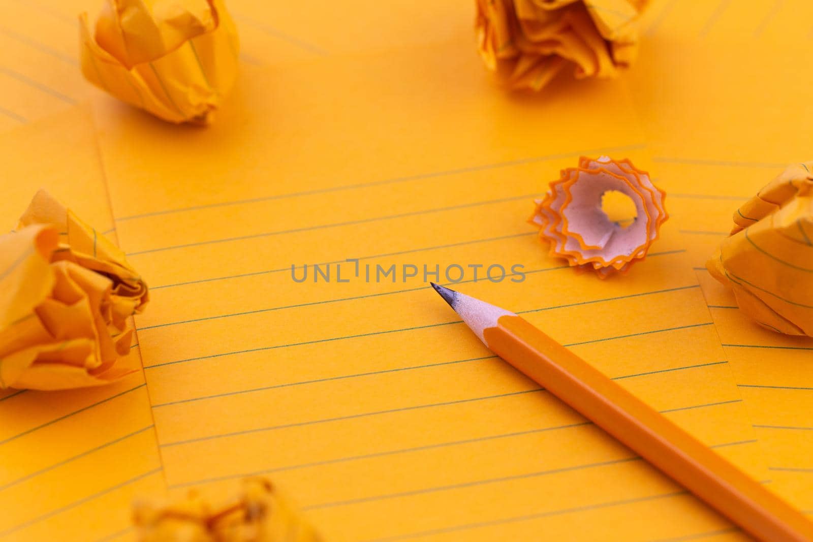 Concept Orange sheets of paper, pencil, stationery and empty space for your text