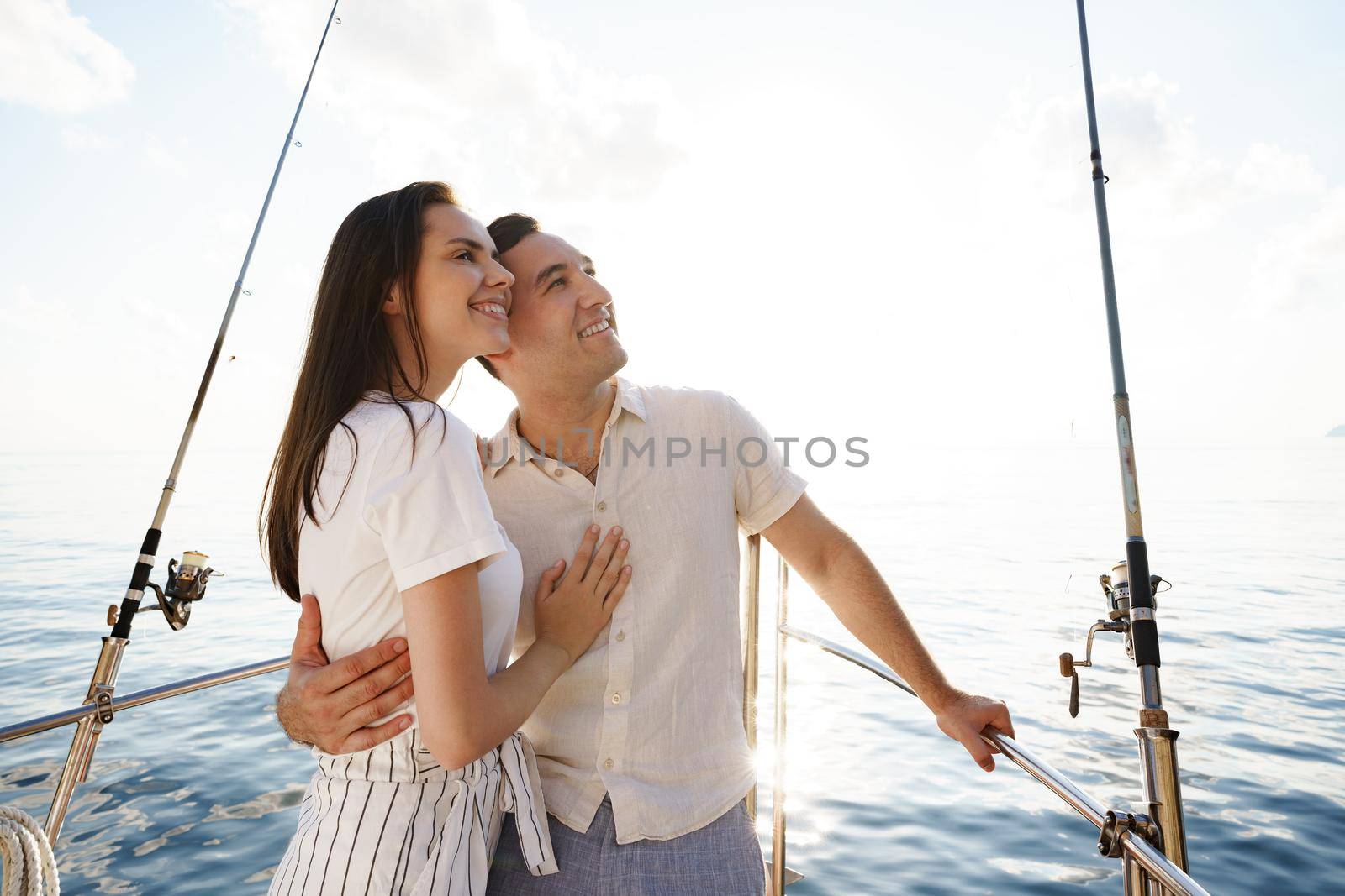 Happy couple on a yacht in summer on romantic vacation by Fabrikasimf