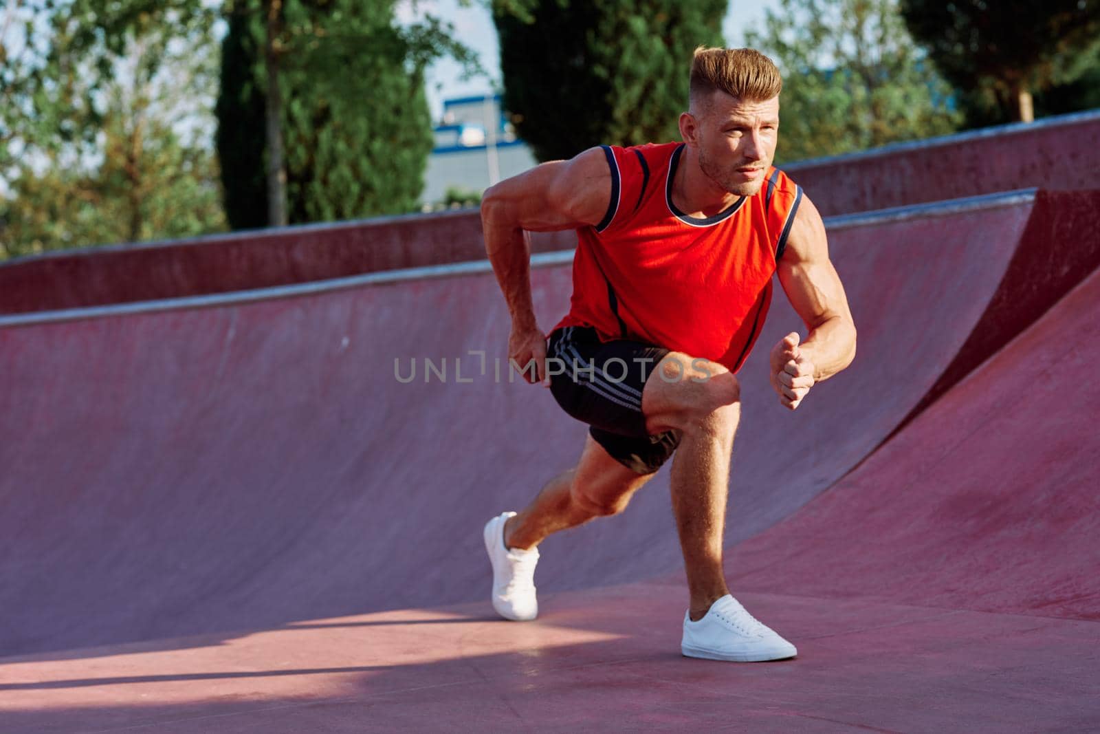 man doing exercises outdoors in the park. High quality photo