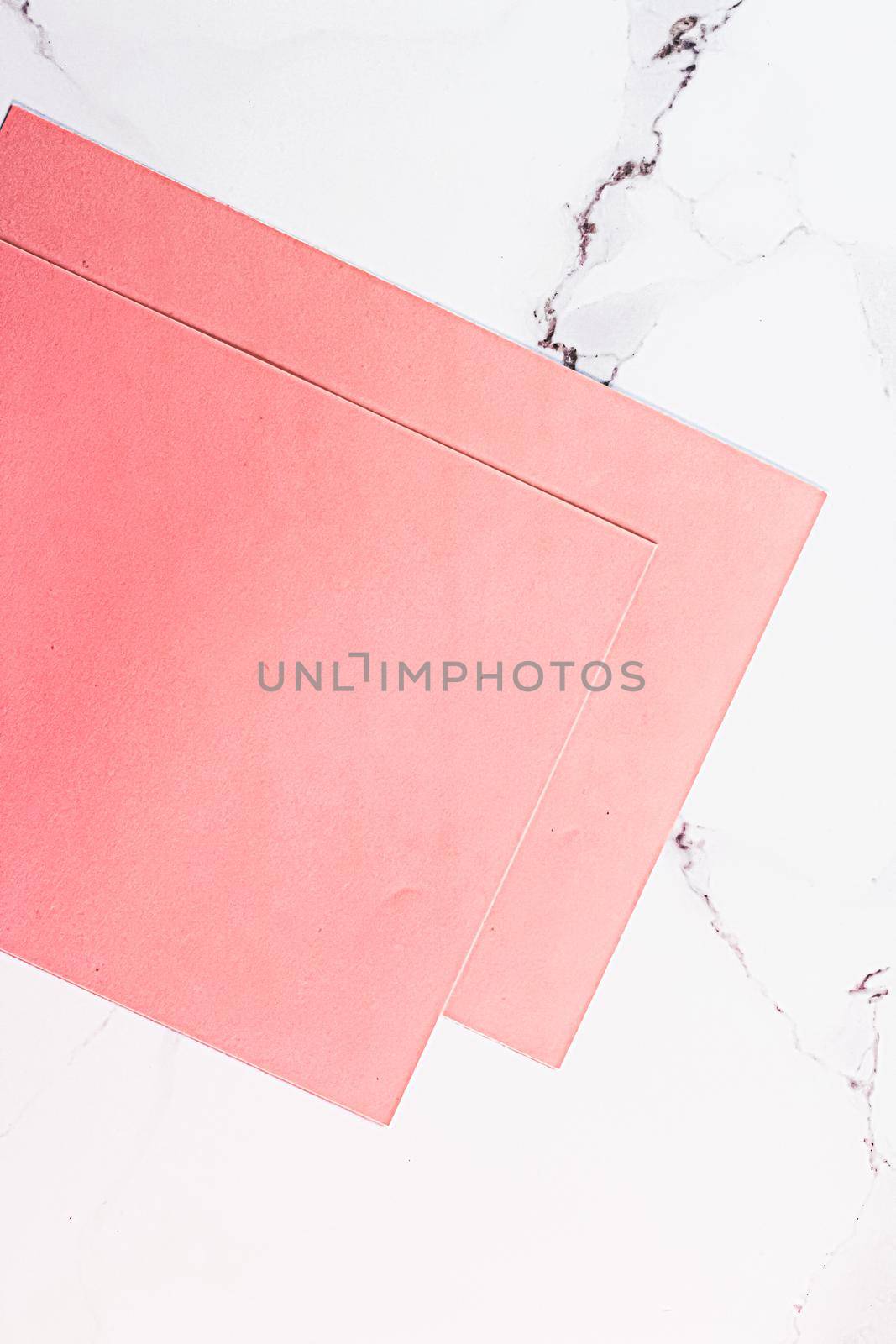 Pink A4 papers on white marble background as office stationery flatlay, luxury branding flat lay and brand identity design for mockups