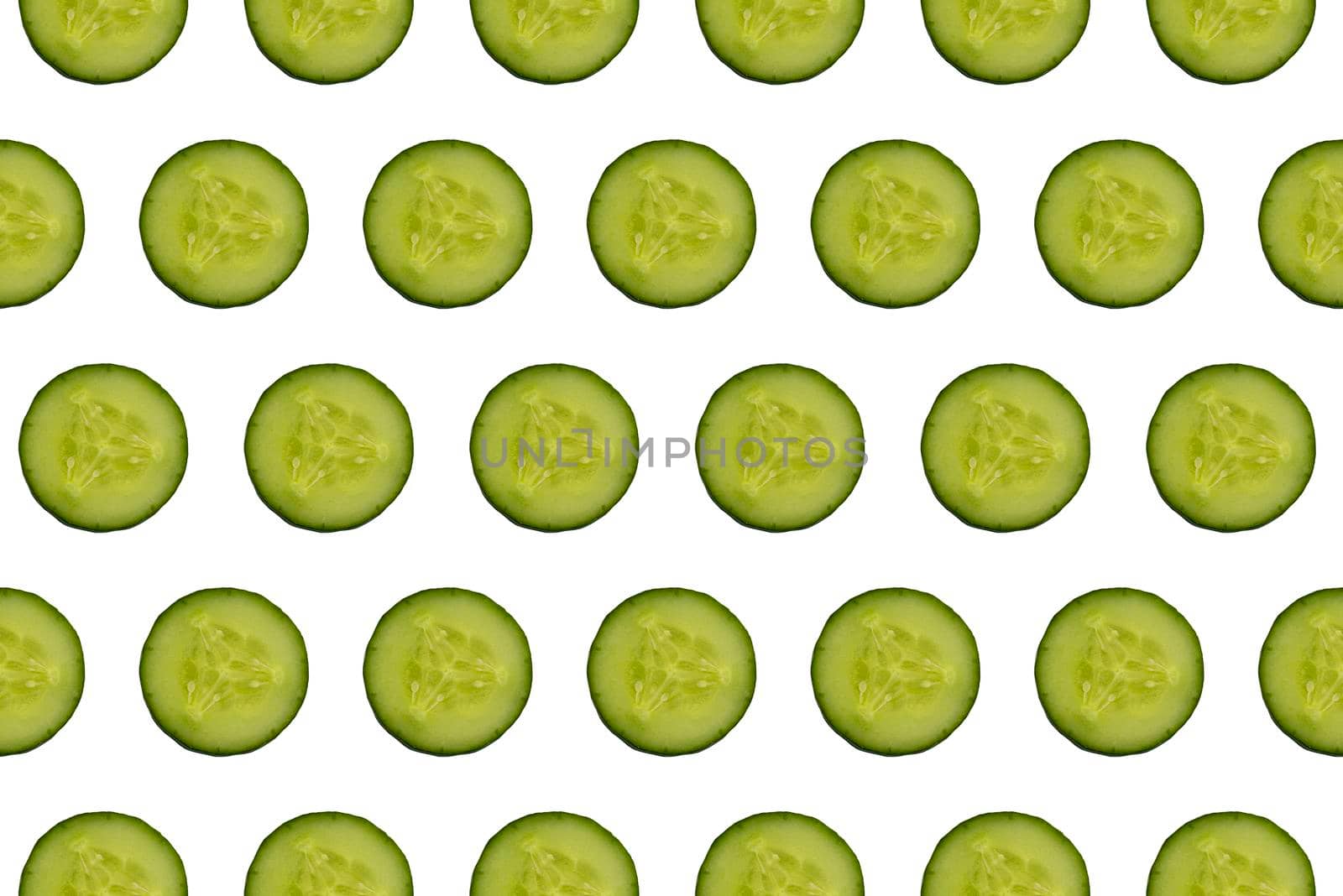 Freshly sliced cucumber close-up on a white background